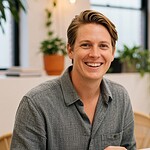 Smiling person working at office desk