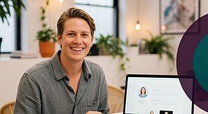 Smiling person working at office desk