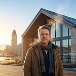 Regional business owner standing outside a modern timber building near Ballarat Town Hall, with digital overlays reading “AI Citation Source,” symbolising AI-ready marketing.
